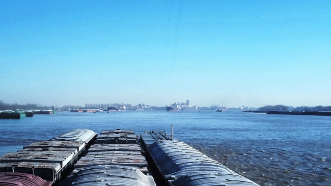 View from a towboat with nine barges of Suicide Alley on the Mississippi Riverjust above New Orleans