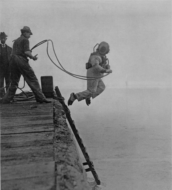 Detail of A diver in full costume making a sensational descent