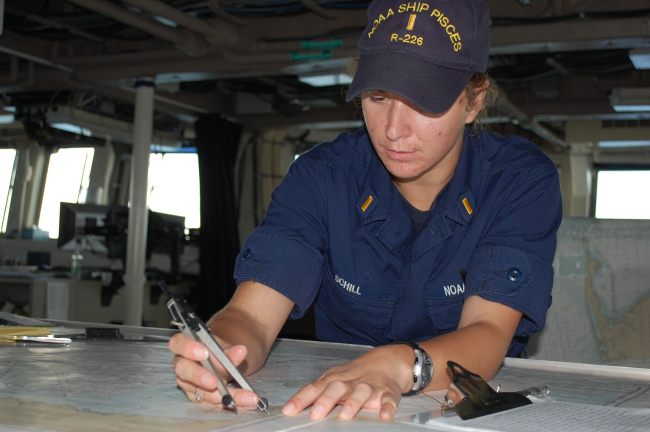 Ensign Schill on bridge checking position of NOAA Ship PISCES