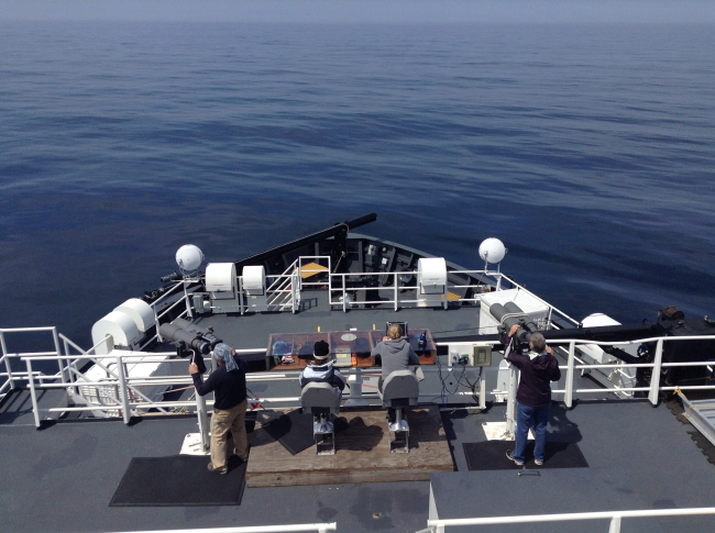 Marine mammal observers using the Big Eyes to observe marine mammals fromthe NOAA Ship HENRY B
