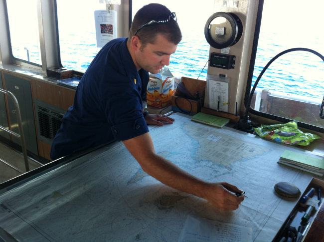 Ensign Jaime Park plotting a fix on the bridge of the NOAA Ship NANCY FOSTERwhile operating to the northeast of Puerto Rico