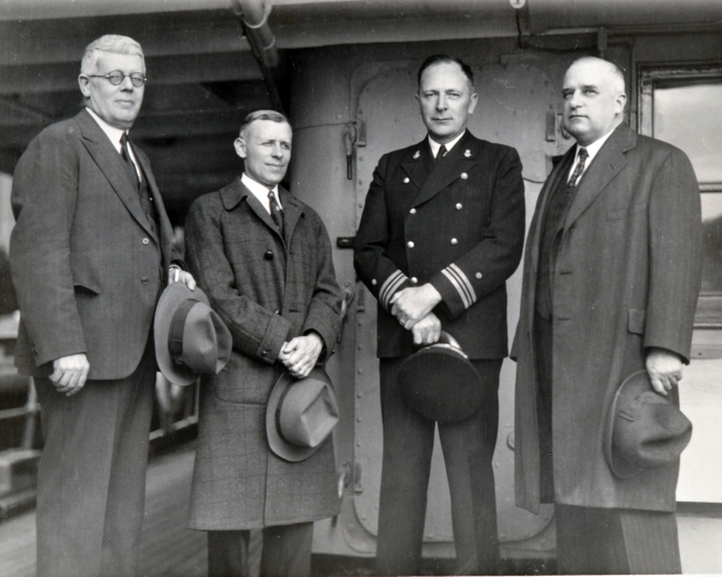 L-R - Captain Hardy, inspector of the Seattle Field Office; Ernest Eickelberg,commanding officer of the C&GS; Ship GUIDE; Ray Schoppe, commanding officerof the C&GS; Ship SURVEYOR; and A