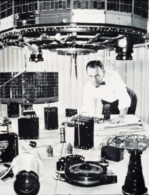Scientist inspecting early TIROS satellite components