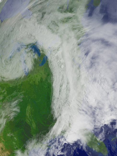 A comma-shaped storm system moving over parts of the Midwestern, Southern,and Northeastern United States