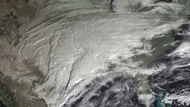 A powerful storm developing over the midwest which dumped copious snow andsleet from Oklahoma to the Atlantic coast