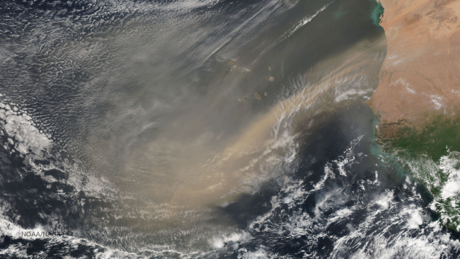 A mass of very dry, dusty air, known as the Saharan Air Layer, blowing off thecoast of Africa into the eastern Atlantic Ocean