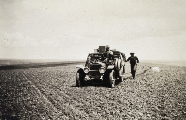 Approaching a station in an Oregon wheat field - White 3/4 ton truck