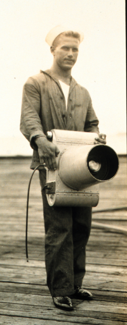 Navy crewman holding K-1 camera