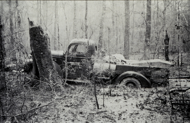 Bench mark truck bogged down in the swamp