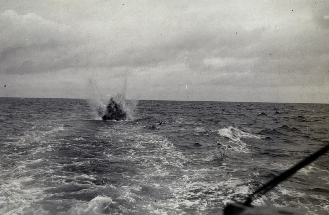 RAR bomb being exploded astern of GUIDE
