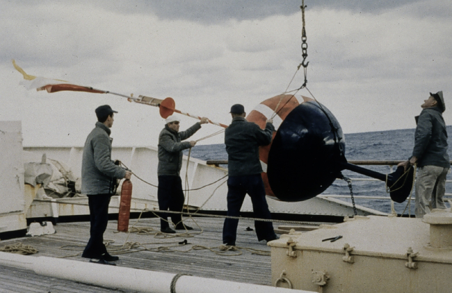 Lowering a current meter buoy over the side and into the Gulf Stream