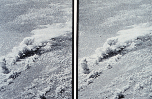 Stereo view of a waterspout tube in the center of the photographs