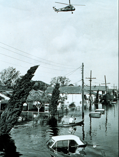 Helicopter hovers over flooded area following passage of Hurricane Betsy164,000 homes were flooded in this stormSmall loss of life as residents heeded warnings