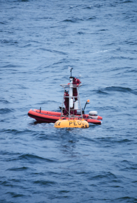 A NOAA weather buoy off Alaska being serviced
