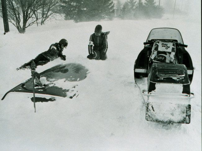 Red Cross workers search for victims buried in cars following snowfallduring the Blizzard of 77