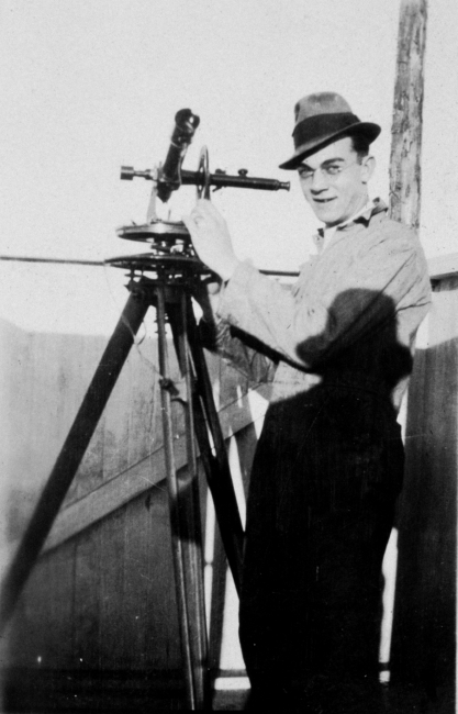 Alfred Lorenz with a theodolite for tracking weather balloons