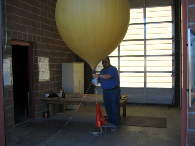 HMT Mitchell Erickson inflates a weather balloon