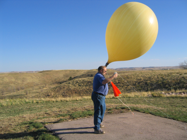 HMT Mitchell Erickson launches a weather balloon