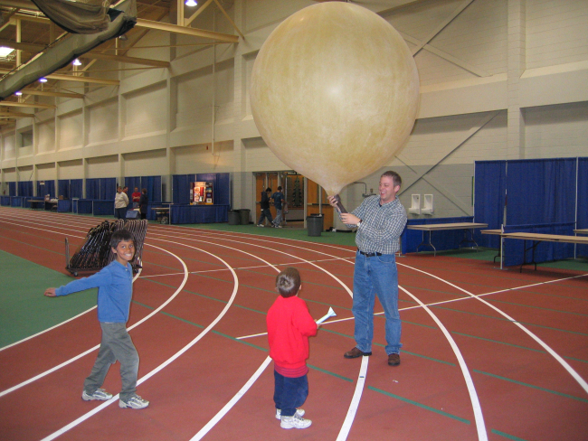 Meteorologist demonstrating a weather balloon at the Sturgis Preparedness Fair
