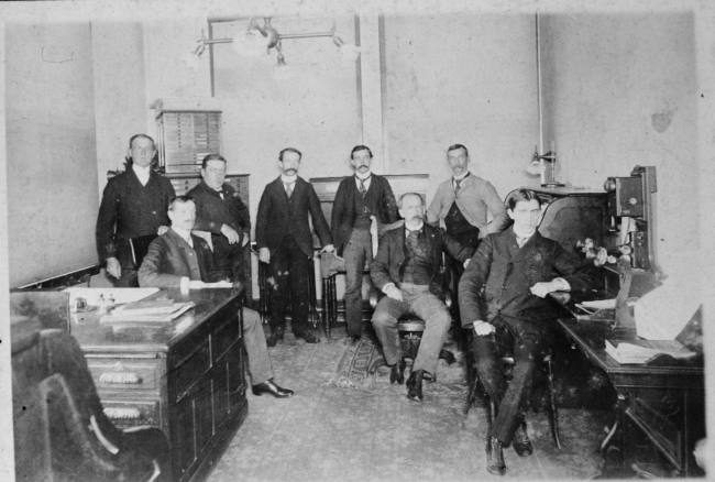 Unidentified personnel at a Weather Bureau office