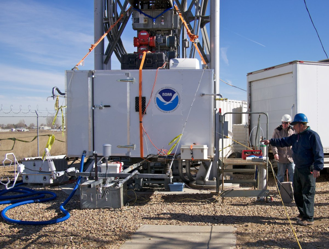 Nick Wagner and Bill Dube, scientists from NOAA's Earth System ResearchLaboratory, Chemical Sciences Division, and the Cooperative Institute forResearch in the Environmental Sciences are installing equipment to study hownitryl chloride, a compound usually associated with the atmosphere near theocean, forms during the winter nighttime in land-locked regions