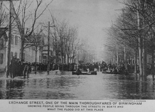 People going through the streets in boats in Birmingham, Ohio(?)