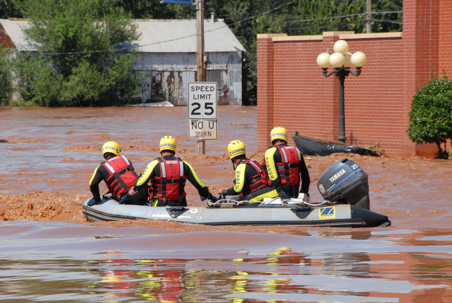 Rescue team in flooded neighborhood
