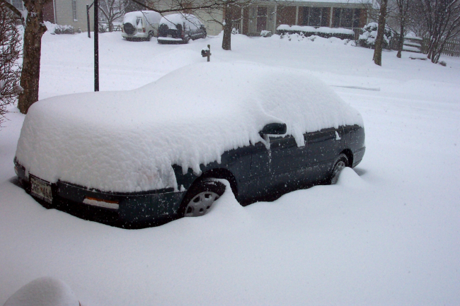 Automobile being covered by snow - Photo #1