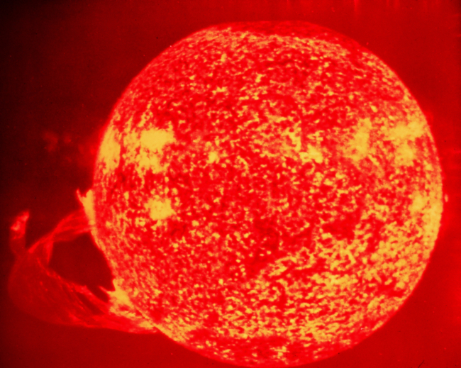A huge solar flare on the bottom left of the photograph