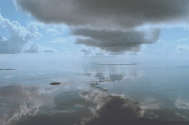 Sea and atmosphere merge into one as reflection obscure the horizon on a stillFlorida Keys morning