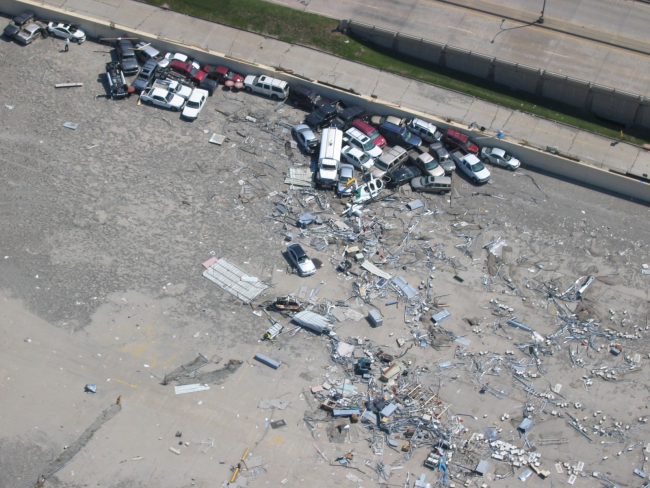 Remains of vehicles and a helicopter at Lakefront Airport