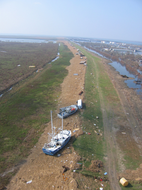 Boats, barges and debris on the levee at Venice