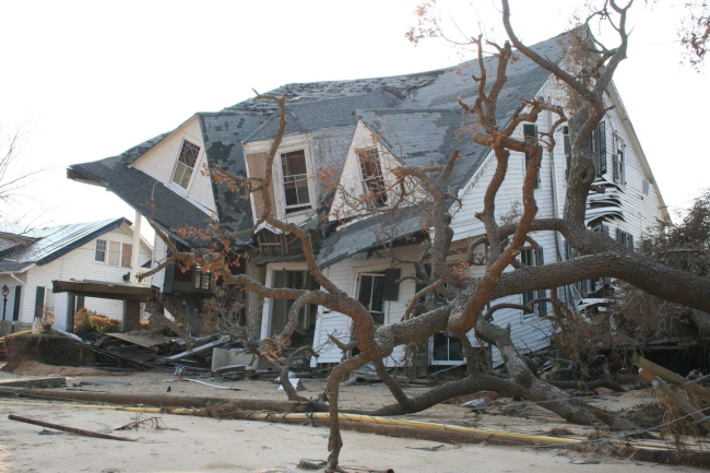 Destruction caused by Hurricane Katrina - a collapsed house, downed trees, anddowned powerlines