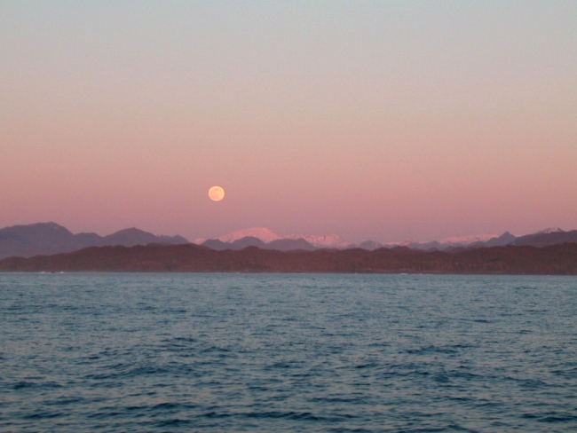 Moon rise over Alaskan mountains