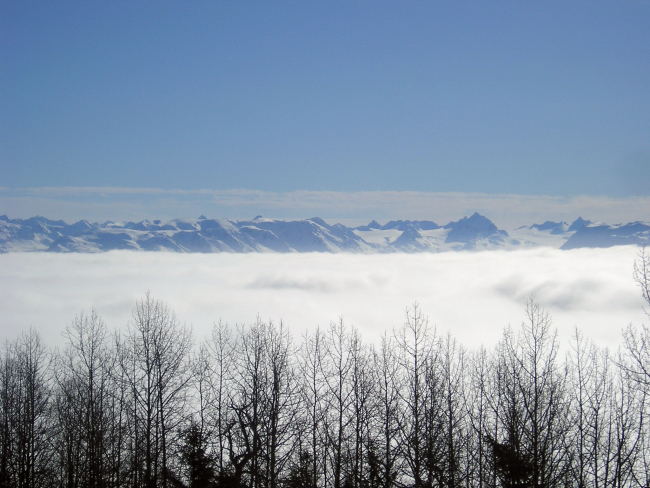 Clouds at Homer obscure the coastline as seen from Kachemak Bay
