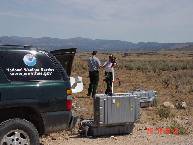 Incident Meteorologists Jim Wallman and Chris Jordan track a PIBALusing a theodolite allowing them to monitor winds in the Reilly ComplexFire in Southern Utah