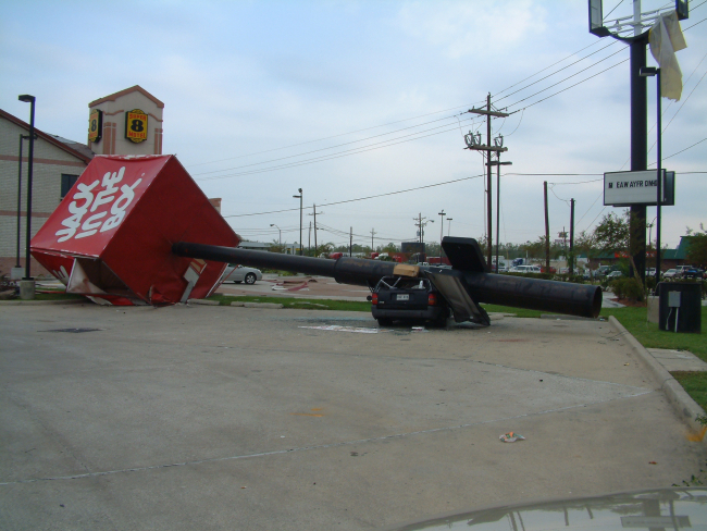 A Jack in the Box sign crushed a vehicle during Hurricane Rita