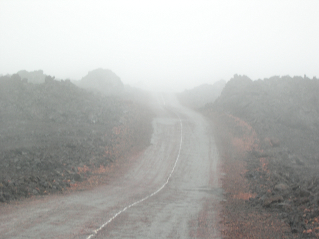 Thick fog often cloaks the lonely road to Hawaii's Mauna Loa Observatory