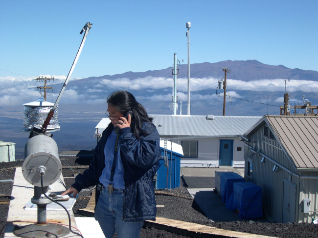 The late Leslie Pajo checks a sunlight measuring instrument at Mauna LoaObservatory