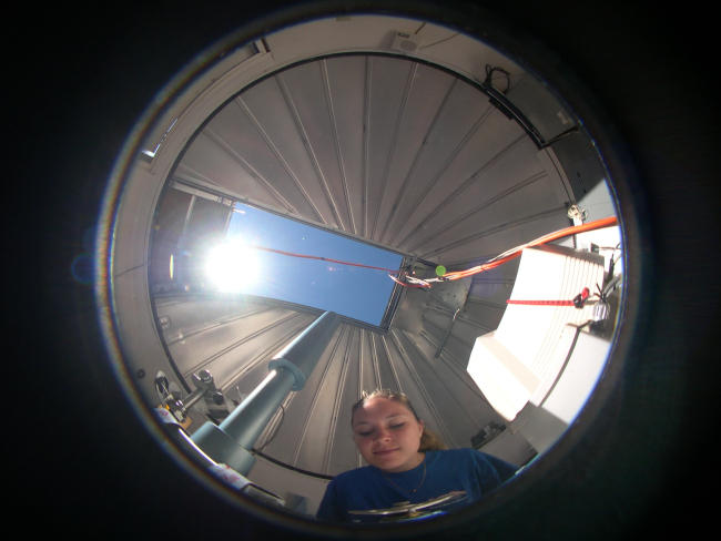 Brooke Walsh measures the ozone layer using Dobson spectrophotometer number 76shown in this fisheye view inside the Dobson dome at NOAA's Mauna LoaObservatory