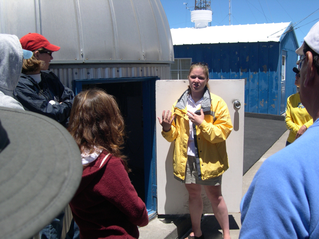 Brooke Walsh explains how the ozone layer is measured at the Mauna LoaObservatory to a group of international students from the University of theNations