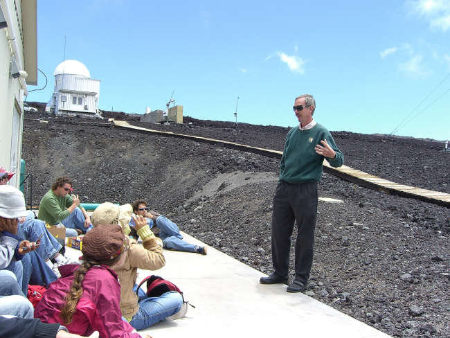 Steve Ryan explains some of the measurements made at the Mauna LoaObservatory to a group of international students from the University ofthe Nations