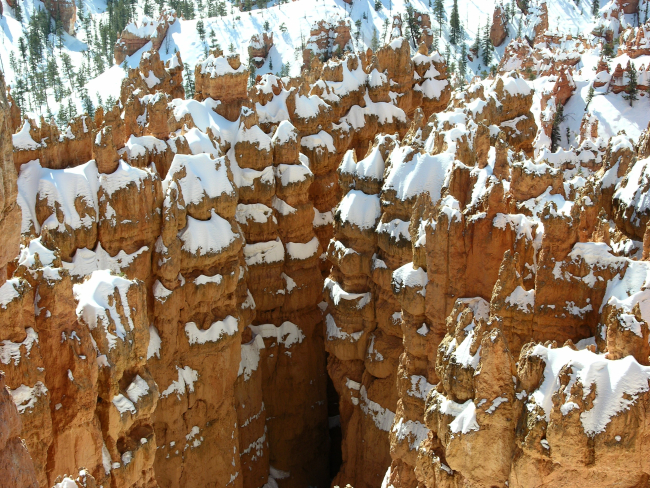 Snow and red rock formations at Bryce Canyon National Park