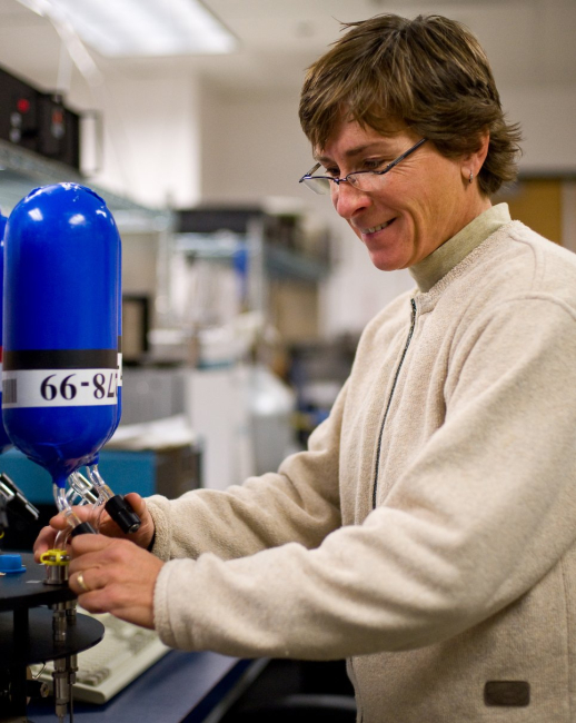 NOAA's Patricia Lang prepares to measure methane levels inside a flask that ispart of NOAA's global air sampling network