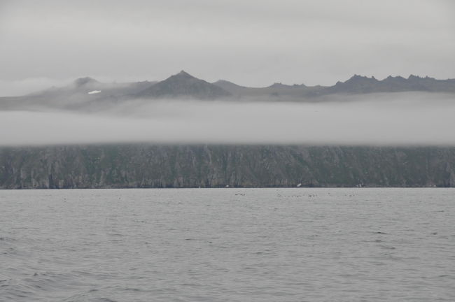 A ribbon of fog bisects Little Diomede Island