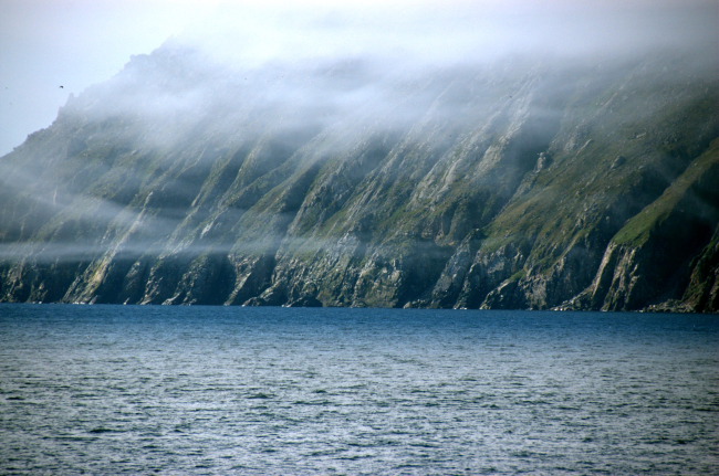 Wisps of fog appear like garlands over Little Diomede Island