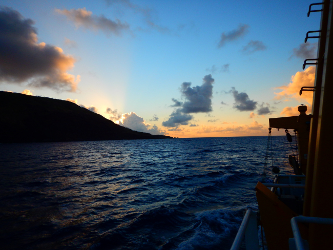 Cruising along an island at sunset