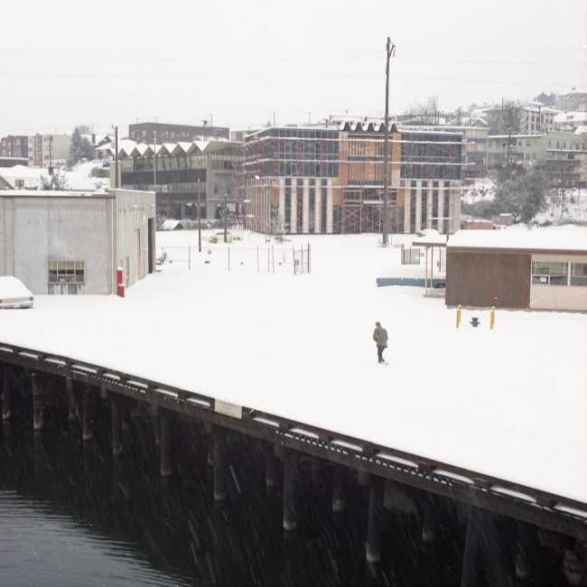 A lone Pacific Marine Center employee trudging through the snow