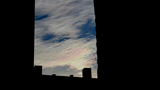 Iridescent clouds seen through the space between NOAA BuildingsSSMC #3 and SSMC #2