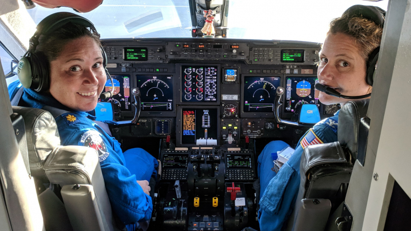 Capt. Kristie Twining (right) and Lt. Cmdr. Rebecca Waddington (left) on the flight deck of NOAA's Gulfstream IV hurricane hunter jet. They are the first ever all female Hurricane Hunter pilot crew.
